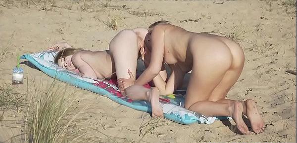  Skinny lesbians licking pussy at the sandy beach